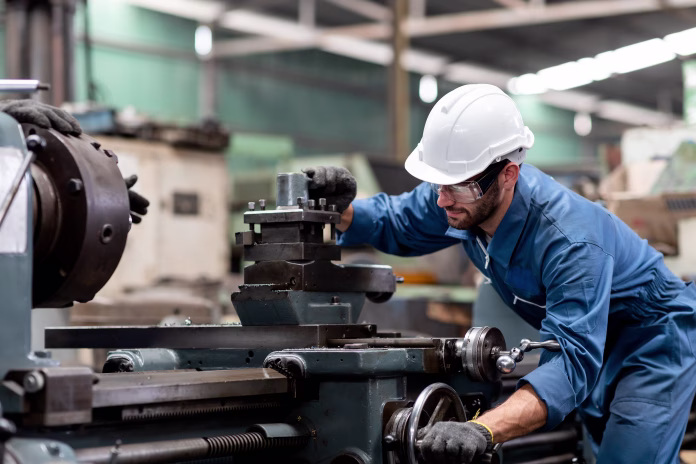 industrial-engineer-worker-in-white-hard-hat-working-with-production-machinery-in-the-factory-stockpack-istock Industrial engineer worker in white hard hat working with production machinery in the factory