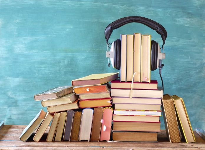 large-heap-of-books-and-heaphones-audio-books-concept-entertainment-and-education-during-corona-lockdown-stockpack-istock Large heap of books and heaphones, audio books concept, entertainment and education during corona lockdown
