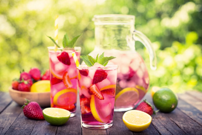 pink-lemonade-with-lemon-lime-and-strawberries-stockpack-istock Pink lemonade with lemon, lime and strawberries