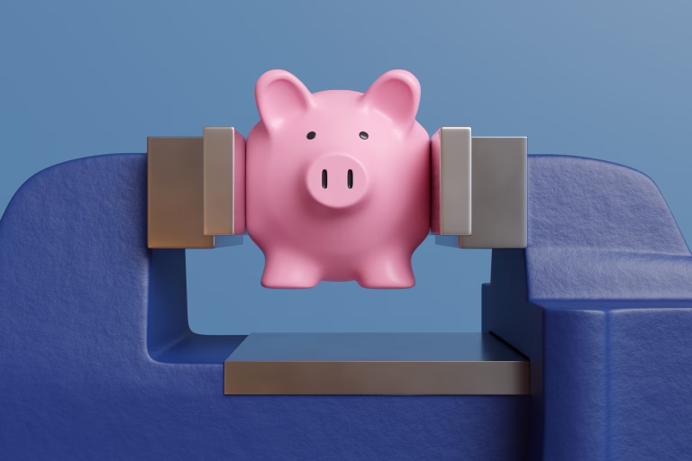 Pink piggy bank being pressed and crushed by a blue vice on blue background. Illustration of the concept of rising cost of living, financial crisis and bankruptcy