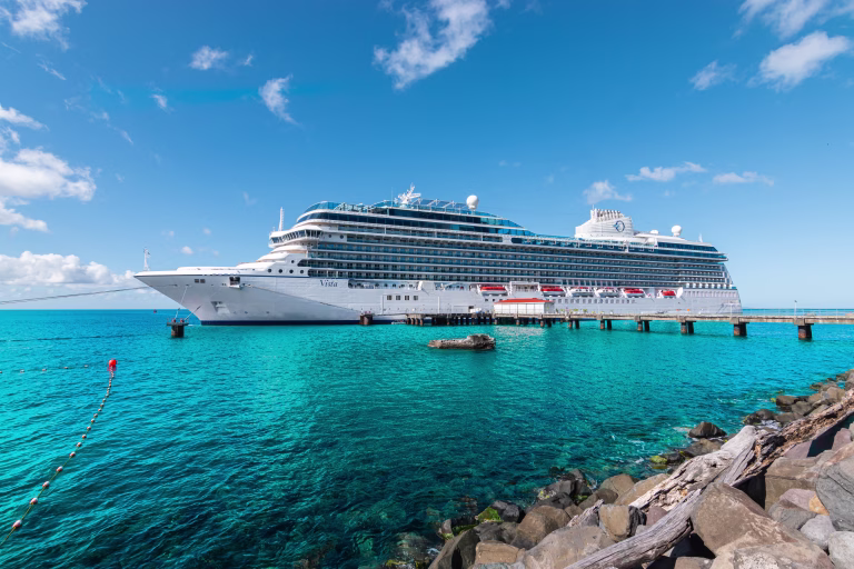 Roseau, Dominica - November 24, 2023: Side view of beautiful cruise ship Oceania Cruises Vista in port of Roseau, Dominica.