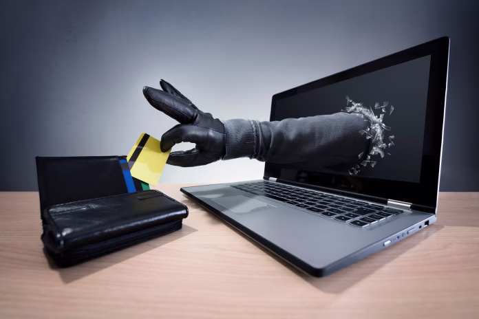 stealing-a-credit-card-through-a-laptop-concept-for-computer-hacker-network-security-and-electronic-banking-security-stockpack-istock Stealing a credit card through a laptop concept for computer hacker, network security and electronic banking security