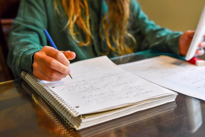 teenage-girl-doing-her-homework-stockpack-istock Teenage girl doing her homework