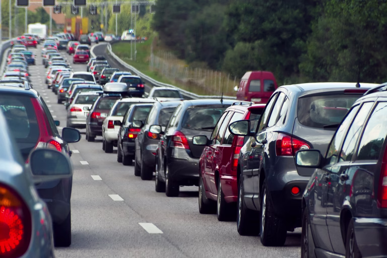 Typical scene during rush hour. A traffic jam with rows of cars.  Shallow depth of field.