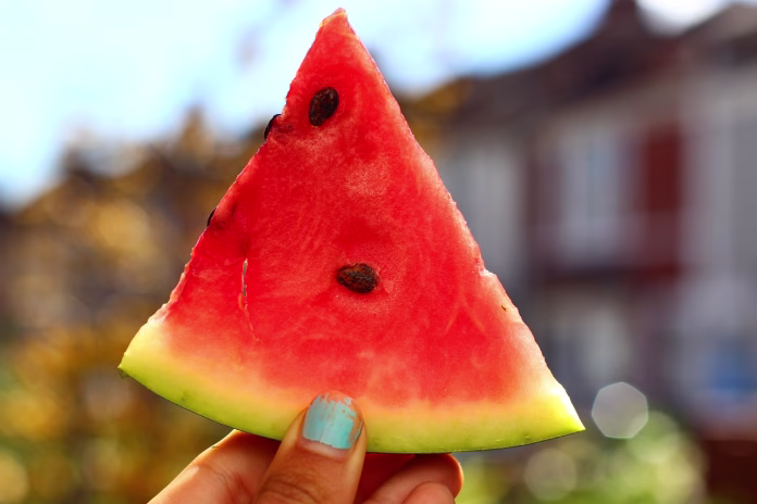 watermelon, fruit, healthy, hand holding a watermelon, hand, bokeh, close up, sweet, fresh, ripe, fresh watermelon