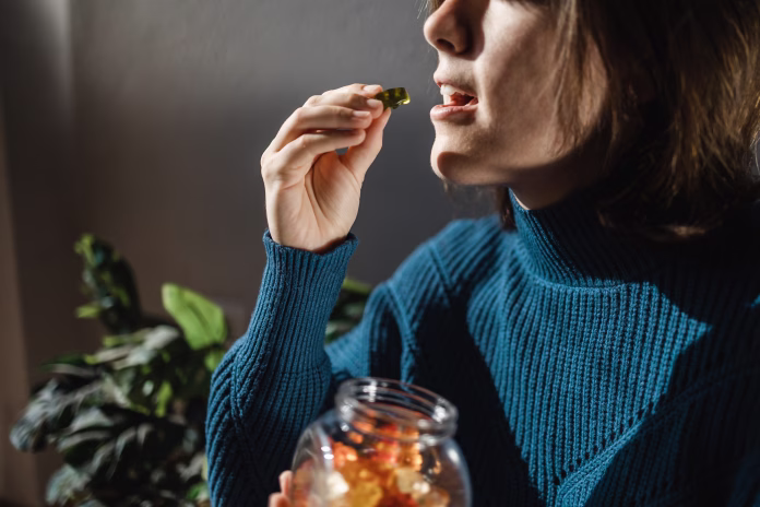 cbd-cannabis-gummy-woman-eating-edible-weed-sweet-candy-leaf-for-anxiety-alternative-treatment-medical-marijuana-stockpack-istock Cbd cannabis gummy - Woman eating edible weed sweet candy leaf for anxiety alternative treatment - Medical marijuana