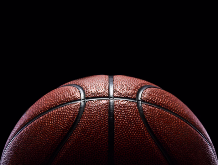 close-up-of-basketball-against-black-background-stockpack-istock Close-Up Of Basketball Against Black Background