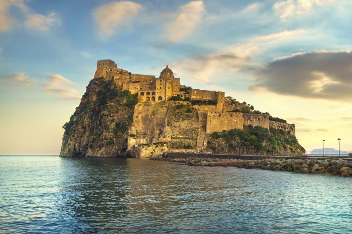 Ischia island and Aragonese medieval castle or Ischia Ponte. Travel destination near Naples in Campania, Italy. Europe.