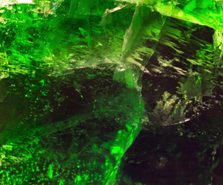 Natural chrome diopside texture abstract background close up