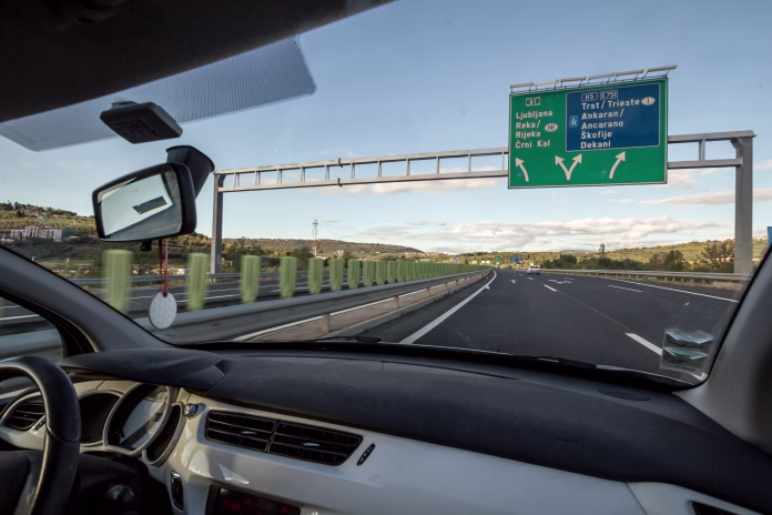picture-of-a-roadsign-on-the-motorway-avtocesta-a1-between-ljubljana-and-koper-at-a-junction-seen-from-the-interior-of-a-car-driving-fast-stockpack-istock Picture of a roadsign on the Motorway Avtocesta A1 between Ljubljana and Koper, at a junction, seen from the interior of a car driving fast