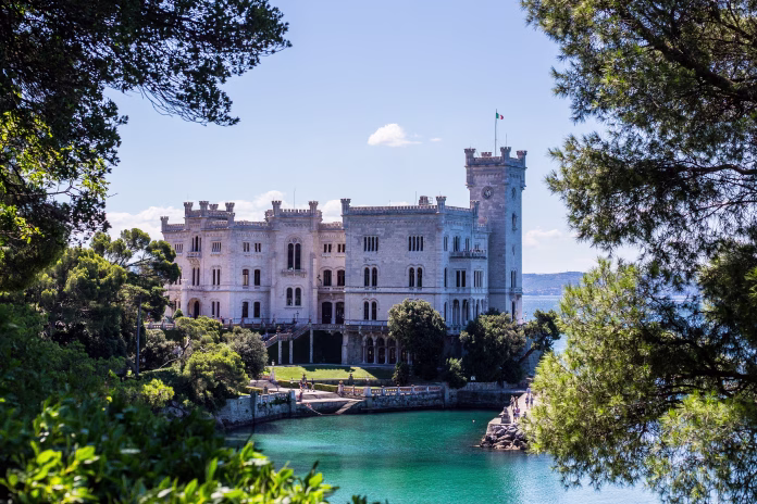 Trieste, Italy - July 16, 2017: The View of Castello di Miramare from the Seashore Park Designed by the Archduke Ferdinand Maximilian.