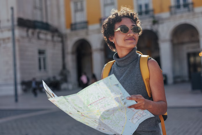 young-woman-consulting-a-map-while-enjoying-her-summer-trip-in-lisbon-portugal-discovering-the-citys-charming-streets-and-architecture-stockpack-istock Young woman consulting a map while enjoying her summer trip in lisbon, portugal, discovering the city's charming streets and architecture