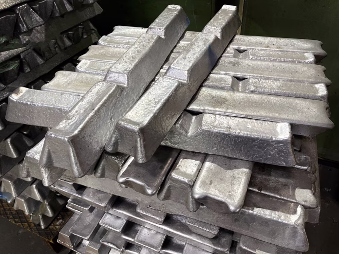 aluminum-alloy-ingots-stacked-in-the-foreground-ready-for-casting-raw-material-stockpack-istock aluminum alloy ingots stacked in the foreground, ready for casting, raw material