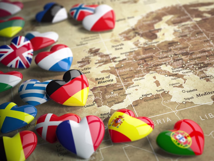 Map of Europe and hearts with flags of european countries. Travel EU concept. 3d