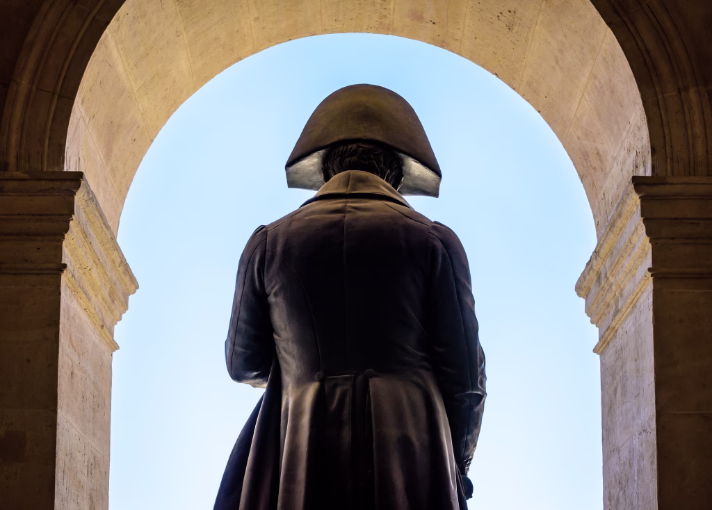 Rear view of the statue of Napoleon Bonaparte by french sculptor Charles Emile Seurre on the balcony of the court of honor of the Hotel des Invalides in Paris, France.