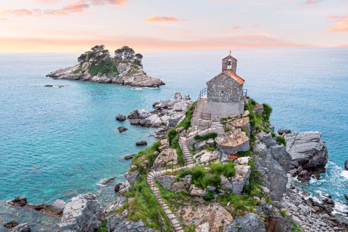 scenic beauty of Montenegro with a drone shot of Sveta Nedjelja and Katic islands near Petrovac, showcasing their rocky cliffs and small church on top