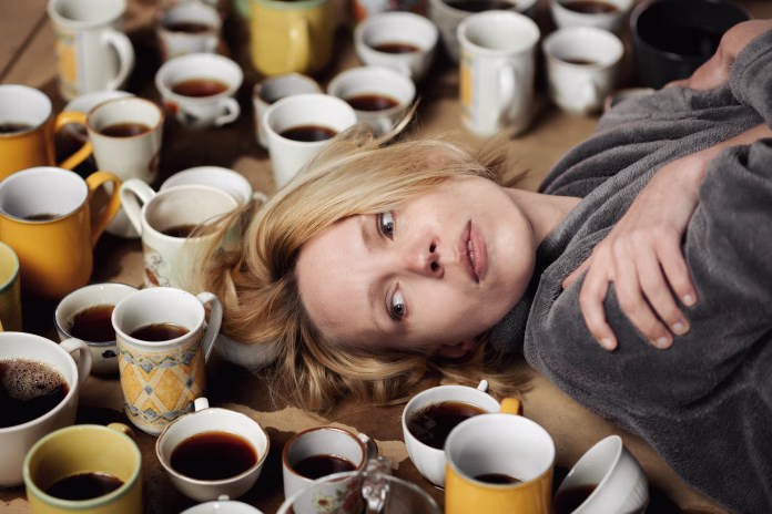 Sleepless, awake woman surrounded by many cups of coffee. Deadline, keep up, be in good shape, overtime concept.