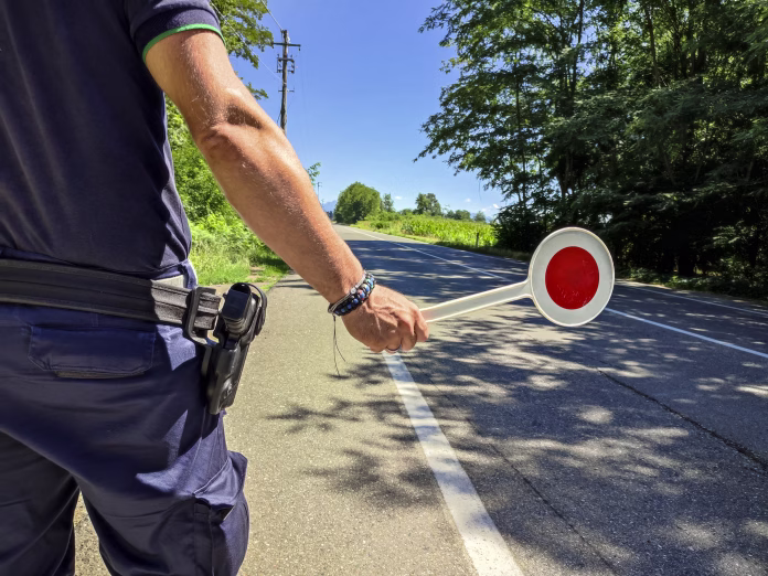 Policeman with a paddle close-up