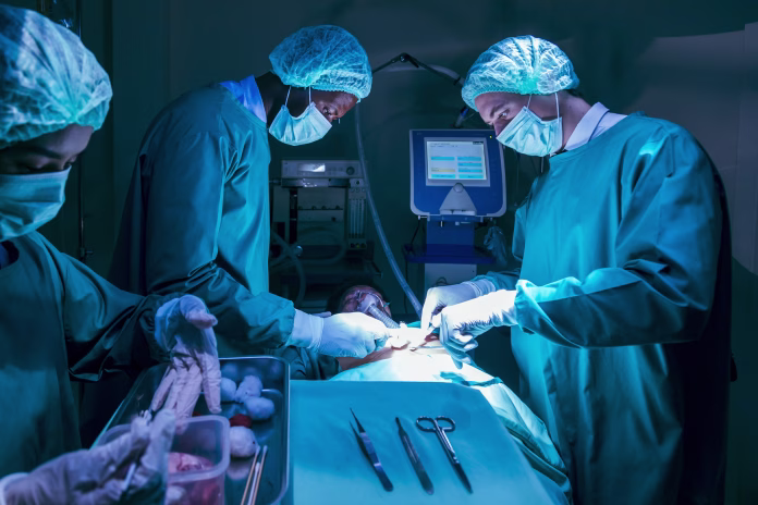 Team of surgeon doctors are performing heart surgery operation for patient from organ donor to save more life in the emergency surgical room