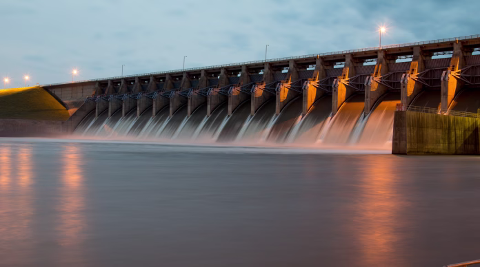 The Keystone Dam in Oklahoma with all the gates open and flowing a lot of water. Shot at Twilight.