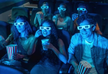 Gen Z želi manj seksa in več animacije na zaslonu Group of young people wearing 3d glasses watching a movie at the cinema, eating popcorn and drinking soda, enjoying their leisure time