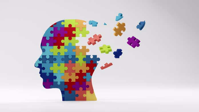 Human head profile and jigsaw puzzle