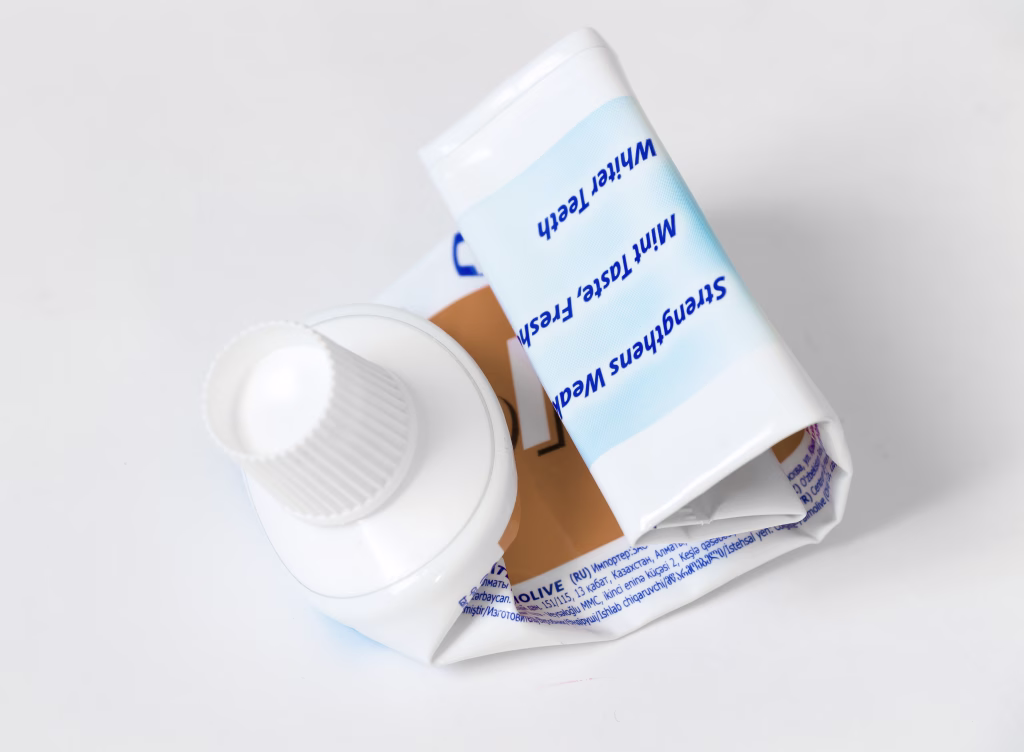 The empty tube of toothpaste on a white background