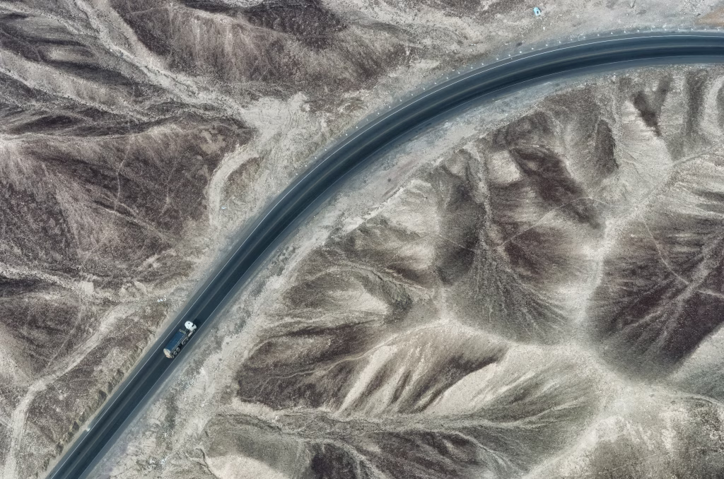 A truck run through Nazca desert, Peru