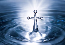 500 let radikalnega anabaptizma: reformacija, ki je šla predaleč Christian holy water with crucifix cross background. Purity water for ritual.