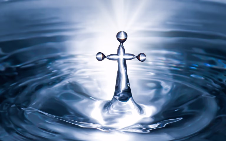Christian holy water with crucifix cross background. Purity water for ritual.