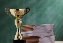 ED.VITA – prva nacionalna nagrada za trajnostnost v visokem šolstvu Close-Up Of Trophy By Books