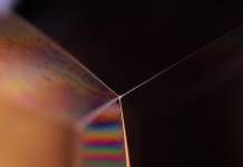 Kako deluje ogledalo? Glossy green liquid forms, scientific abstraction, geometric shapes