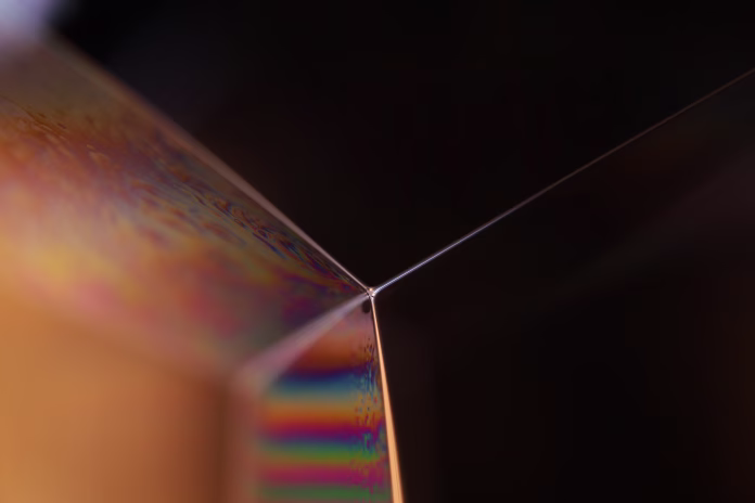 Glossy green liquid forms, scientific abstraction, geometric shapes