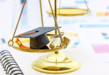 Ali se doktorat v Sloveniji izplača? Graduate study abroad program concept : Graduation cap on a balance scale of justice and a certificate / diploma. Graduate study abroad program is a program that accept students from foreign countries