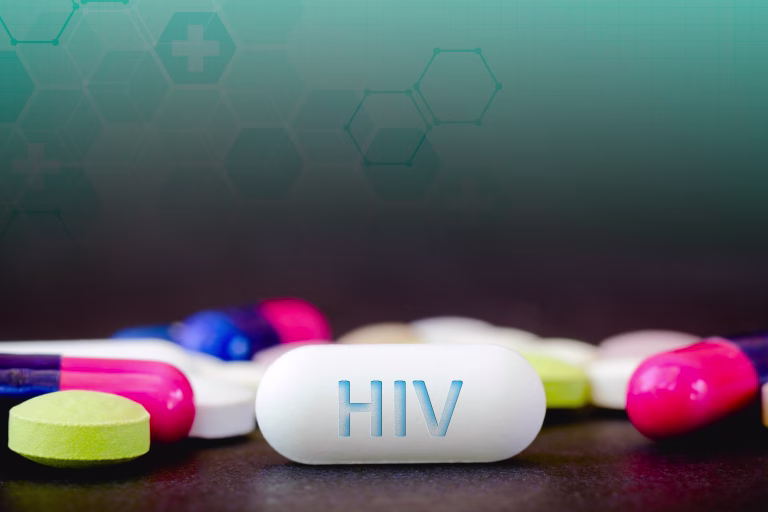 In this photo illustration pills of pharmaceutical drugs of various colors. Text HIV in one white pill. Healthcare and medicine concept.