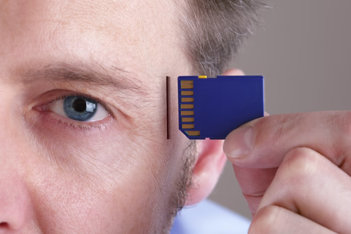 inserting-sd-memory-card-into-slot-in-human-head-concept-for-memory-upgrage-forgetfulness-or-computing-stockpack-istock Inserting SD memory card into slot in human head concept for memory upgrage, forgetfulness or computing