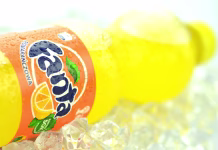 Slovenska Fanta bistveno drugačna od tiste pri sosedih – zakaj taka razlika v ravni sladkorja? Kwidzyn, Poland - May 26, 2014: Bottle of Fanta drink on ice cubes. Fanta is fruit-flavored carbonated soft drink produced by Coca-Cola Company. Fanta was introduced in 1941