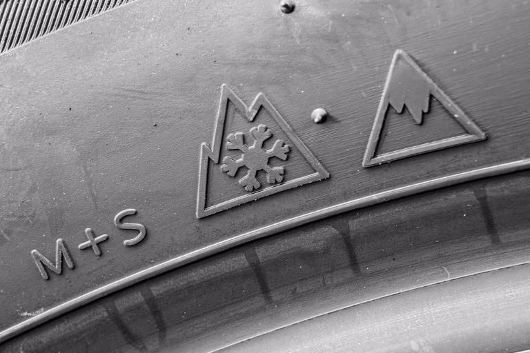 Newest pictograph with icy mountain peak on winter tire sidewall, the new ice-grip symbol, new rating, verified braking test on ice