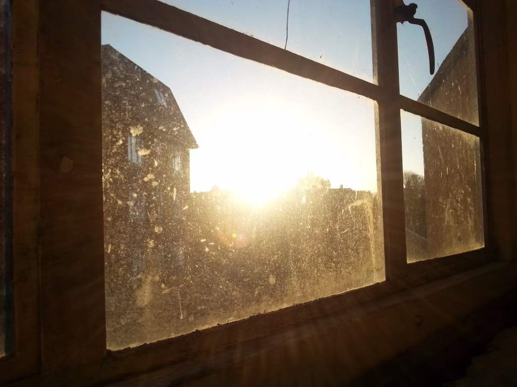 The Sun finds its way even through factories and dirt.