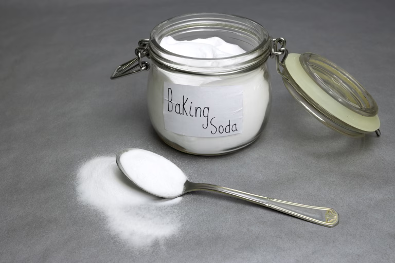 Baking soda isolated on gray background