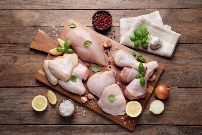 flat-lay-composition-with-fresh-raw-chicken-meat-on-wooden-table-stockpack-istock Flat lay composition with fresh raw chicken meat on wooden table