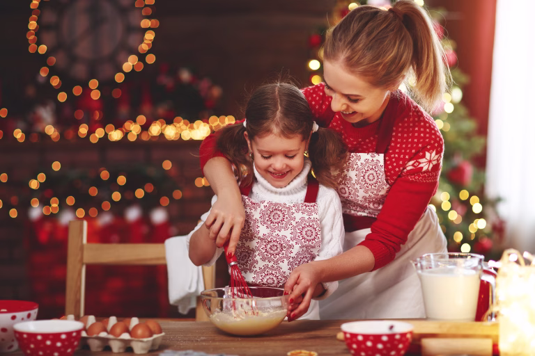 happy funny mother and child  bake christmas cookies