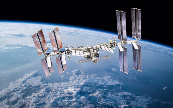 International space station with astronauts. Elements of this image furnished by NASA (url:https://www.nasa.gov/sites/default/files/thumbnails/image/iss060e007297.jpg https://www.nasa.gov/sites/default/files/thumbnails/image/44911459904_375bc02163_k.jpg)