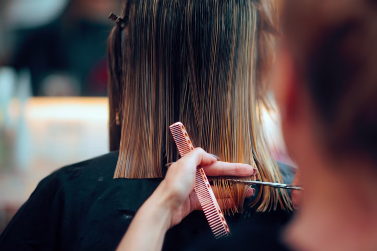 Professional beauty salon worker executing perfect ends trimming