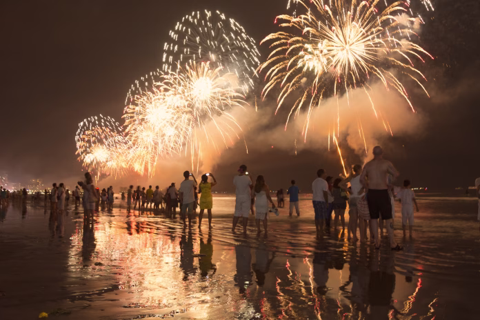 santos-city-brazil-january-01-2015-new-years-celebration-on-the-beach-people-watching-the-fireworks-at-the-waters-edge-stockpack-istock Santos city, Brazil. January 01, 2015. New Year's celebration on the beach. People watching the fireworks at the water's edge.
