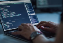 Nejc Rebolj, razvijalec pametnih aplikacij: tehnologija je pač za vse, tudi za kure (INTERVJU) Close-up Focus on Person's Hands Typing on the Desktop Computer Keyboard. Screens Show Coding Language User Interface. Software Engineer Create Innovative e-Commerce App. Program Development