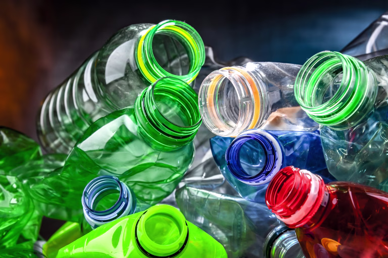 Empty colored drink bottles. Recyclable plastic waste.