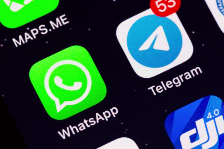 Moscow, Russia - December 13, 2024: Two most popular in the world messengers WhatsApp and Telegram app icons on display of an iPhone.