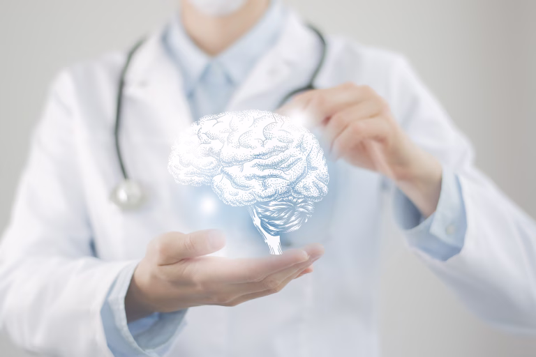 Female doctor holding virtual volumetric drawing of  Brain in hand. Handrawn human organ, copy space on right side, raw photo colors. Healthcare hospital service concept stock photo