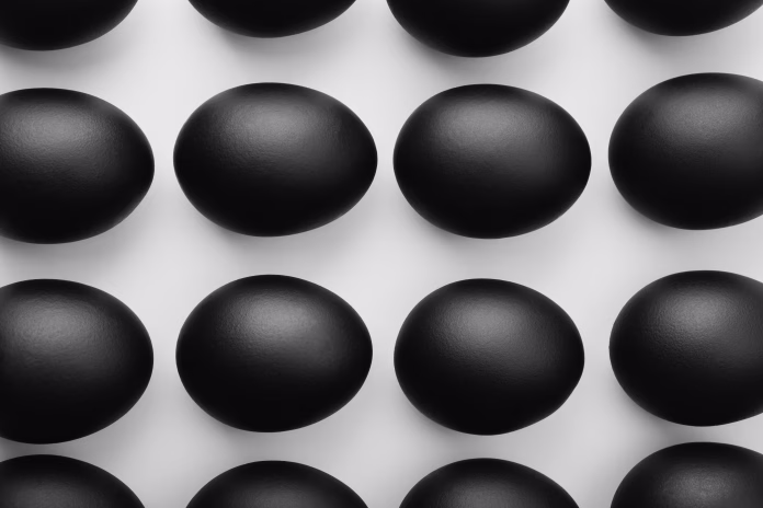 Pattern of black easter eggs on white background. Easter minimalistic concept